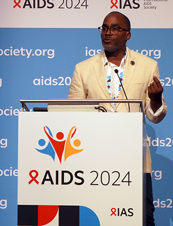 amfAR VP Greg Millett speaks during a session at the 25th International AIDS Conference in Munich, Germany